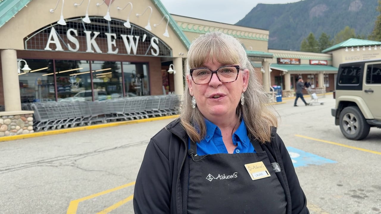 A woman outside a store.