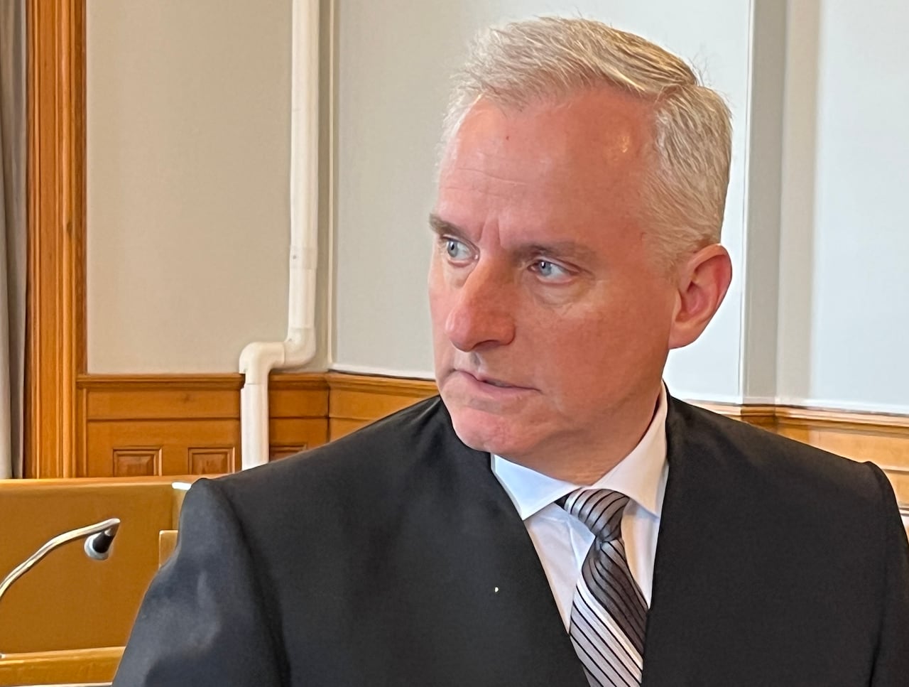 a portrait style photo of lawyer Geoffrey Spencer in a St. John's Courtroom.