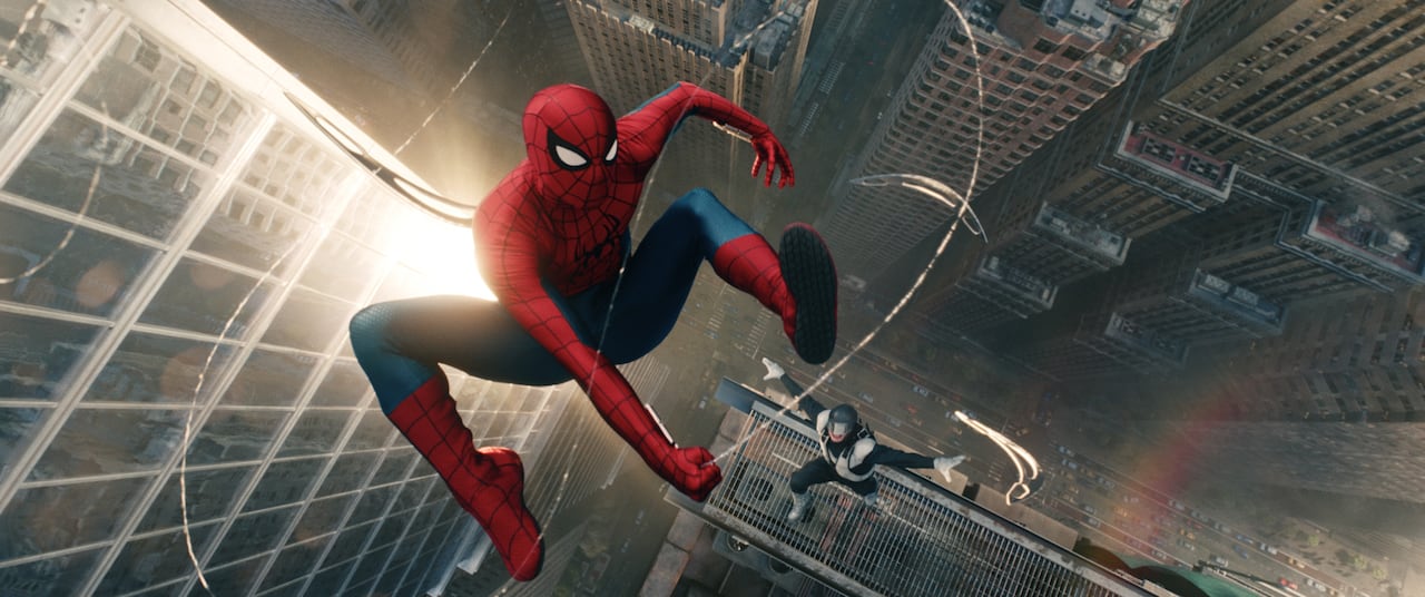 Spider-Man swings above the city being chased by Boomerang, a man in a super villian costume throwing razor sharp boomerangs.