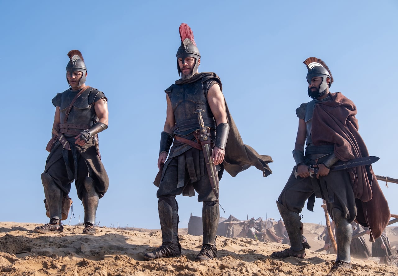 A picture showing three men in gladiator-type armour: Jimmy Gonzales ia Cepheus, Matt Damon as Odysseus and Himesh Patel as Eurylochus in a scene from The Odyssey.