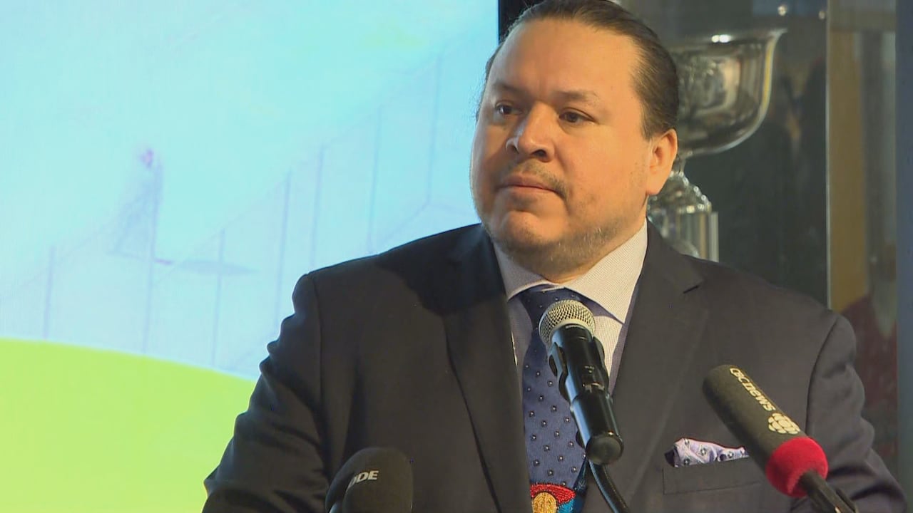 A man speaks at the podium.