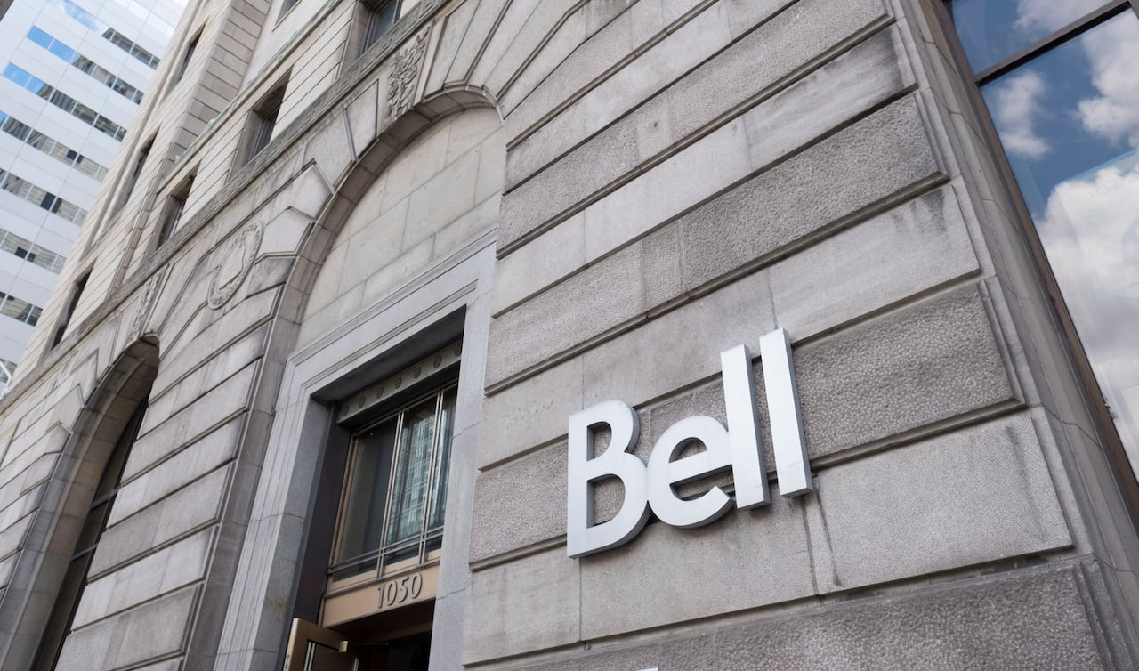 A Bell logo on a stone building.