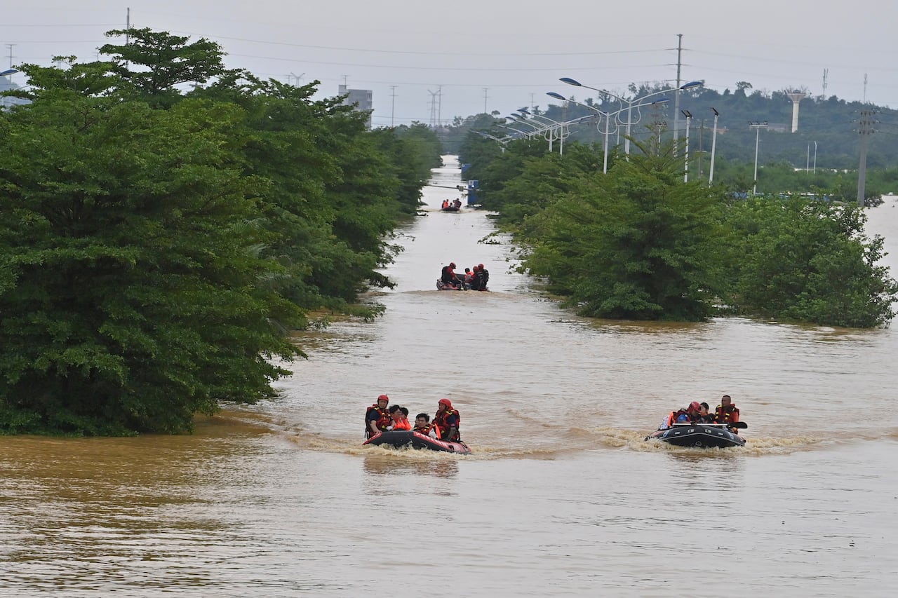 Rescuers use Zokiak boats to rescue people in a flooded area.