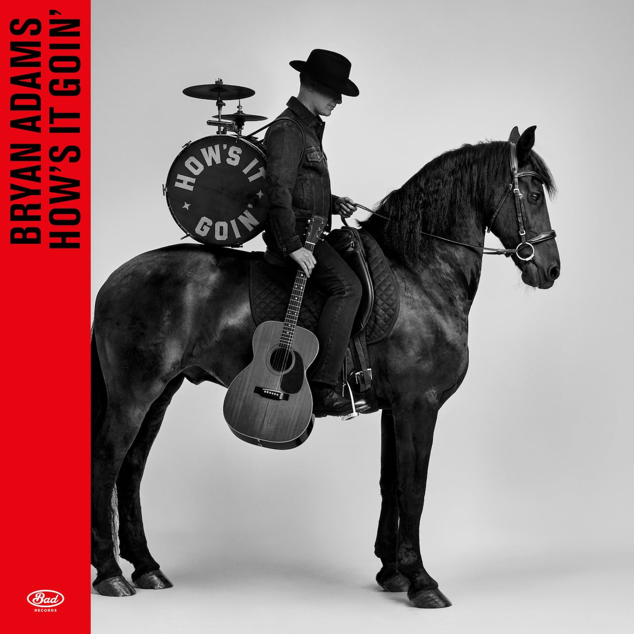 Man on horse in black and white.
