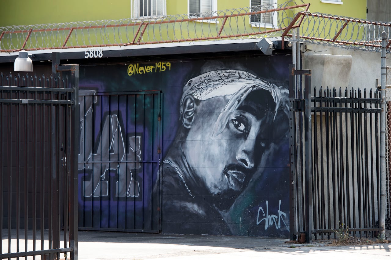 A painting of a rap icon on a wall
