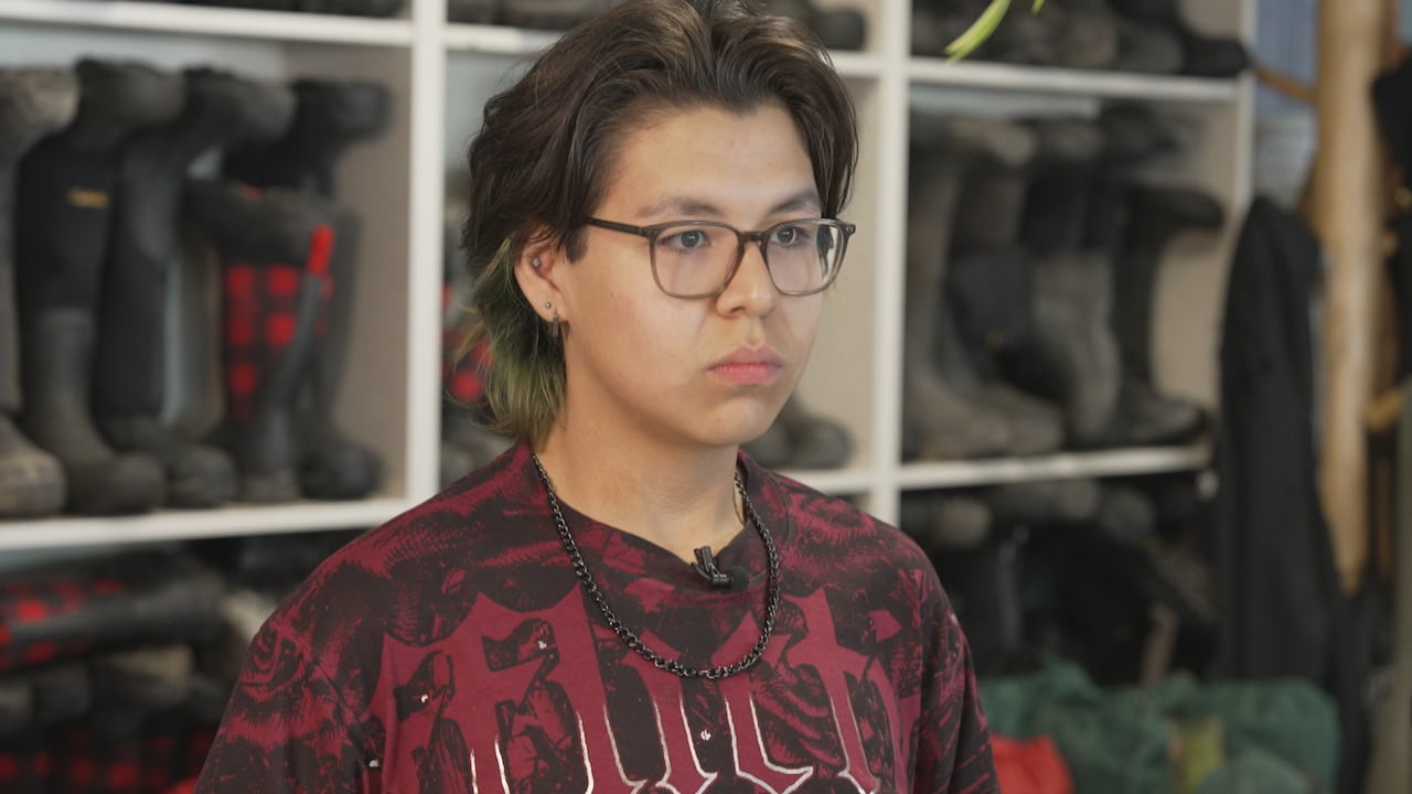 A boy looks off camera