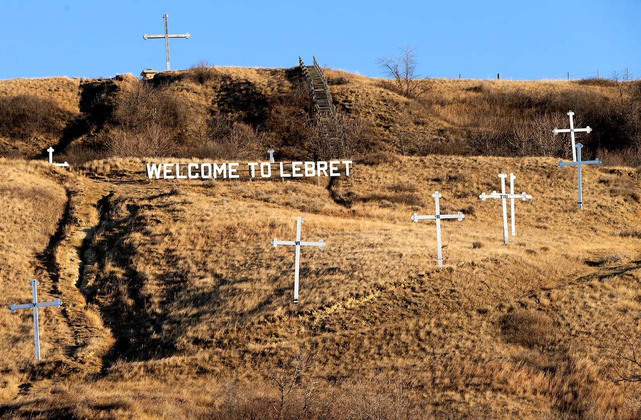 The Welcome to Lebret sign surrounded by crosses pictured in the fall of 2021.