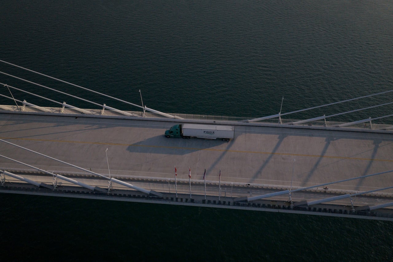 A transport truck is seen from above the Gordie Howe International Bridge on the day the crossing opened, on July 27, 2026.