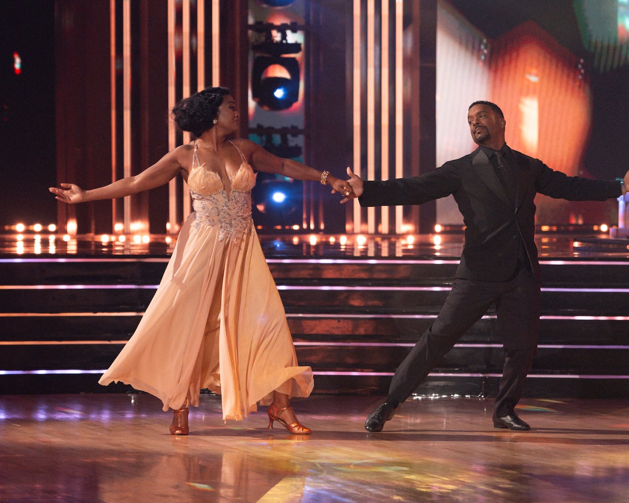 man and woman dancing a ballroom routine