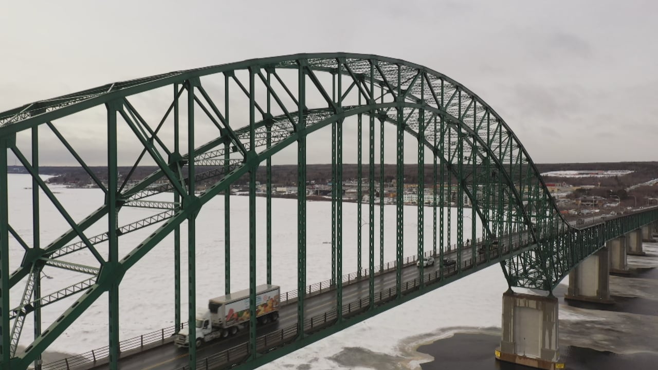 A bridge with an arch over it.