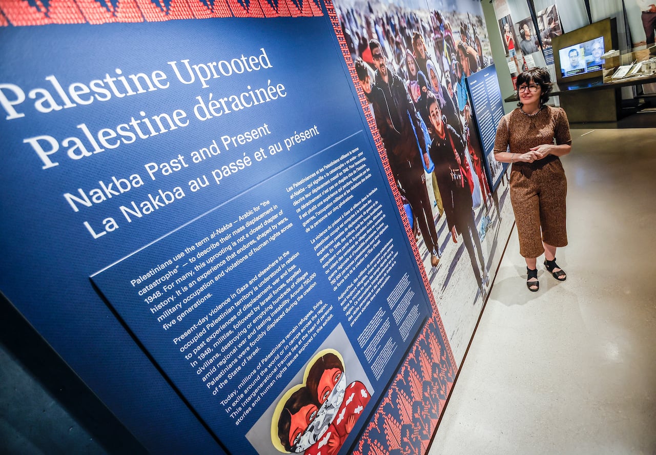 A person views an exhibit in a museum