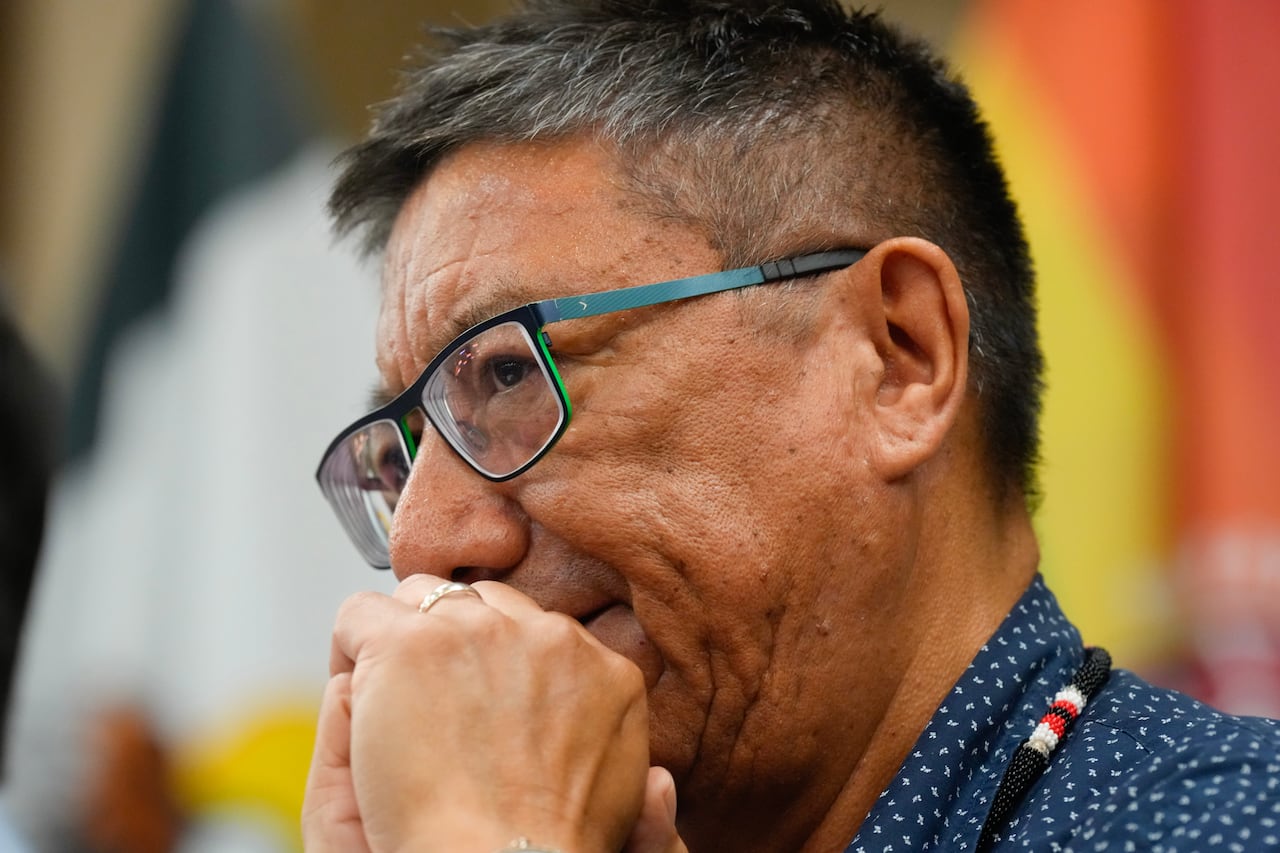 A close-up of a person wearing glasses.