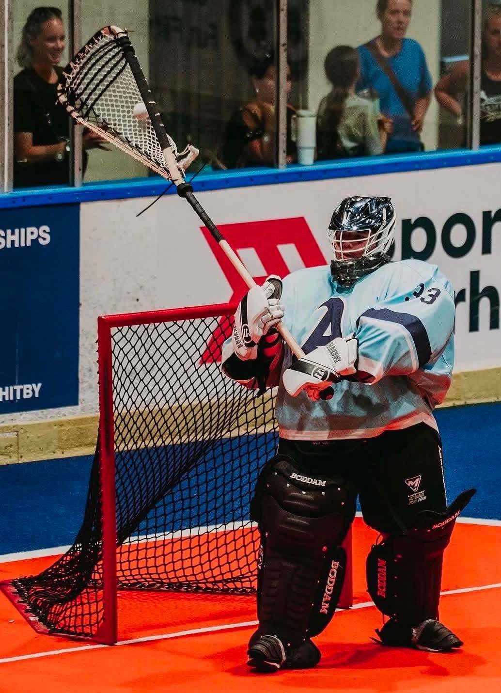 Lacrosse goalie at net.