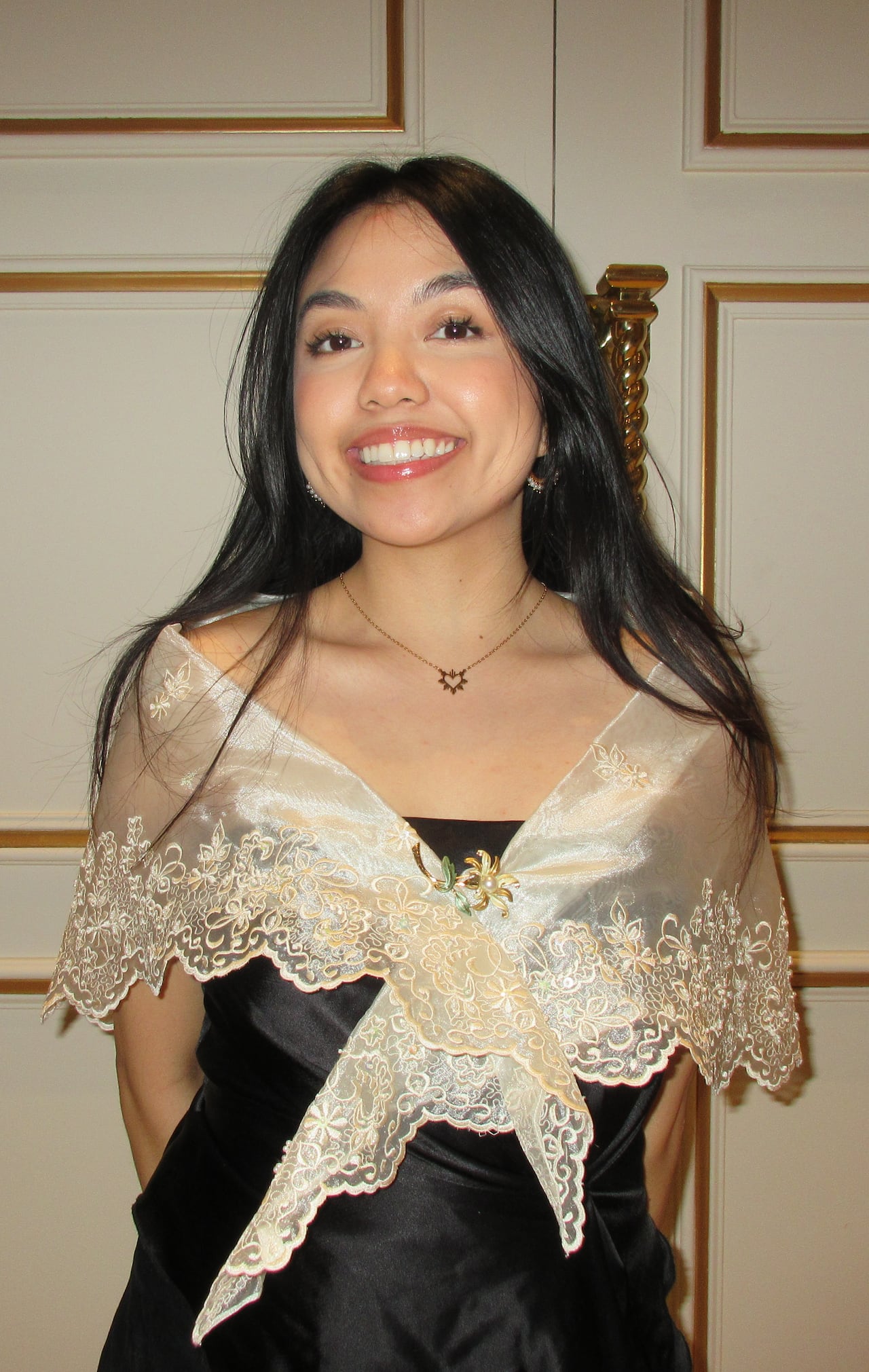 Woman wears dress.