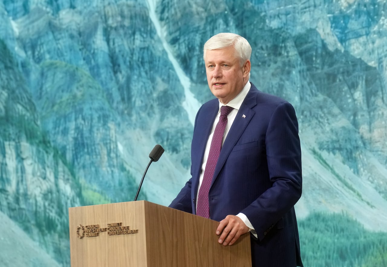 A man speaks at a podium.