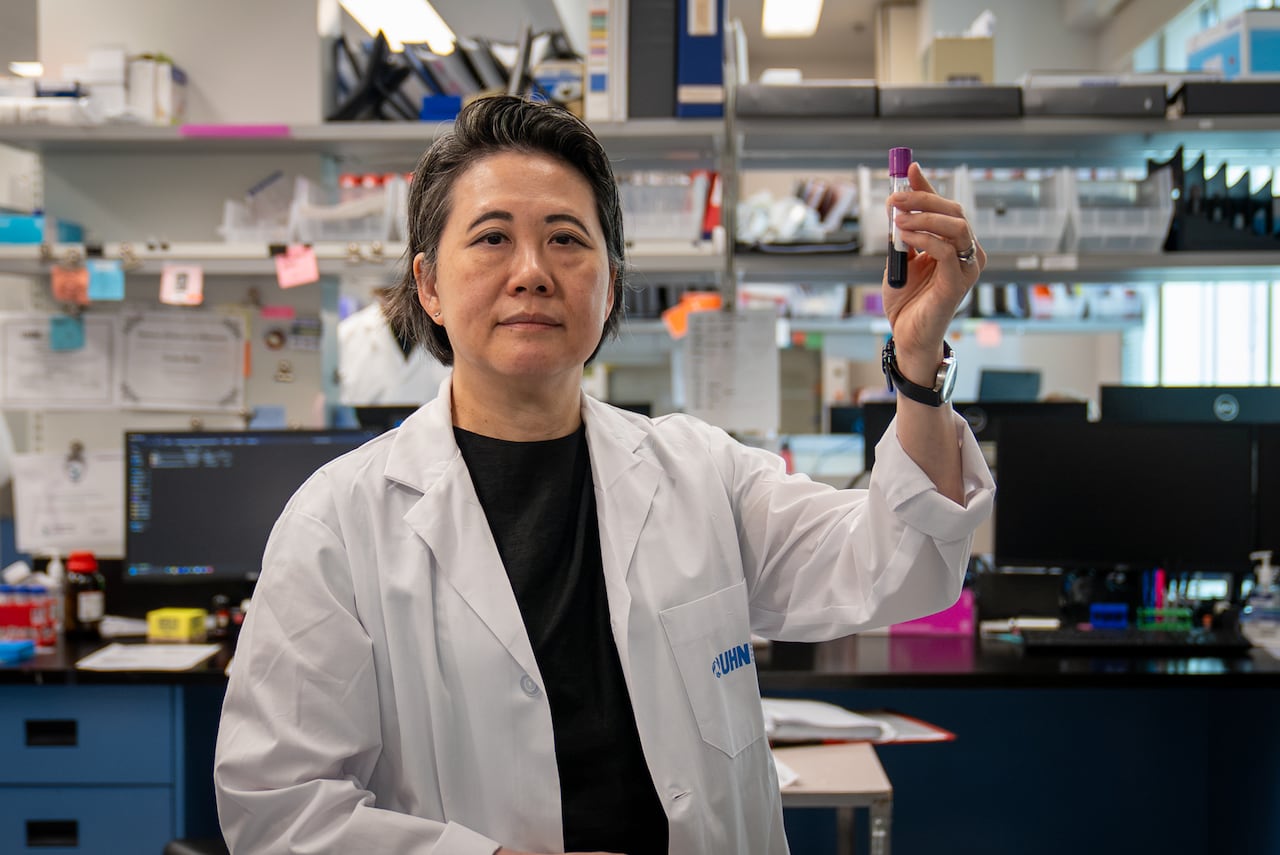 Dr. Lillian Siu, a senior scientist at UHN’s Princess Margaret Cancer Centre and a scientific lead at the Peter Gilgan Centre for Early Cancer Detection Research, holds up a test tube filled with blood.