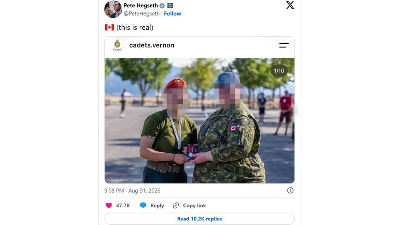 A screenshot of post from X with a photo of two people whose faces are blurred.