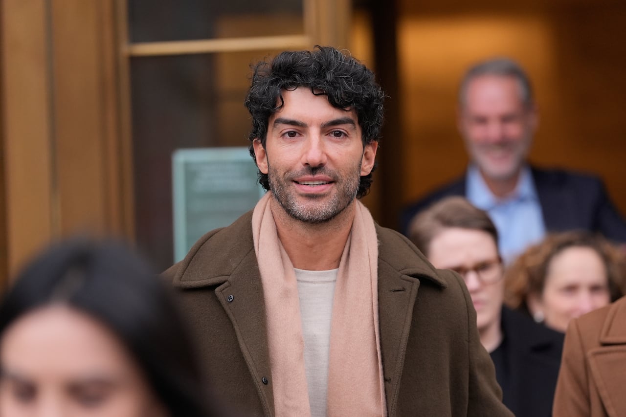 A man stands in a courthouse