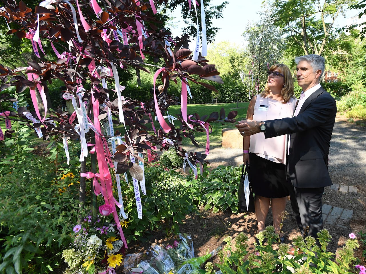 Shooting victim Anastasia De Sousa's parents looking at her memorial tree at Dawson College