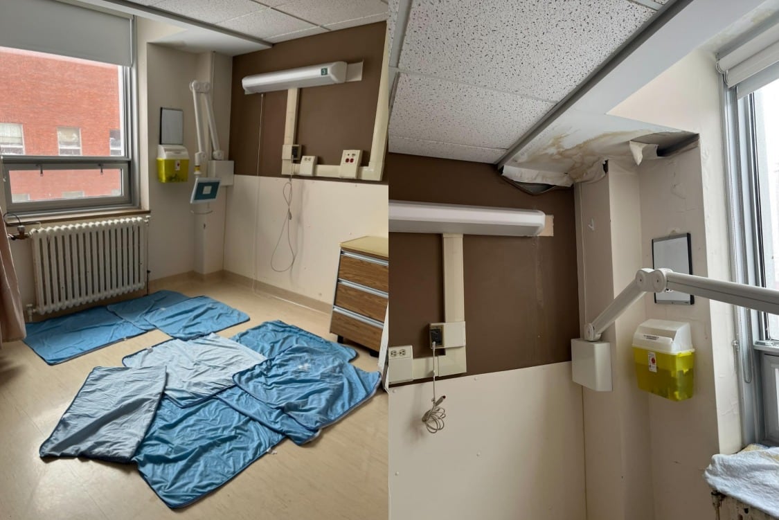 Hospital room with visible leak damage to the ceiling.