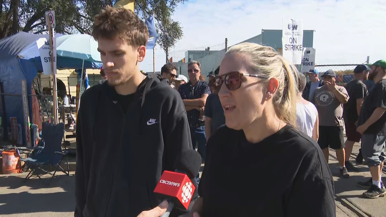picture of woman and man with cbc mic in front