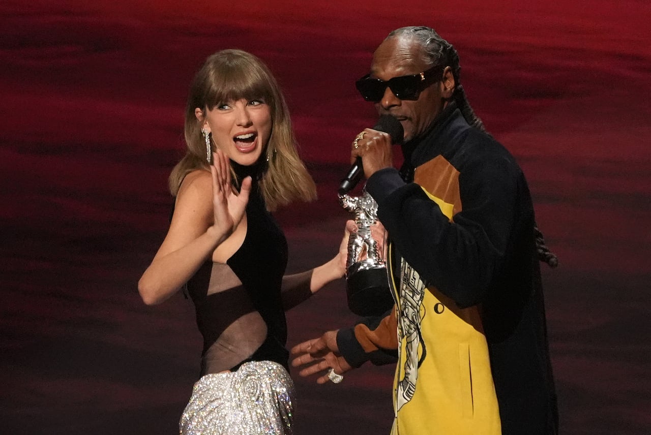 A woman and a man on stage.