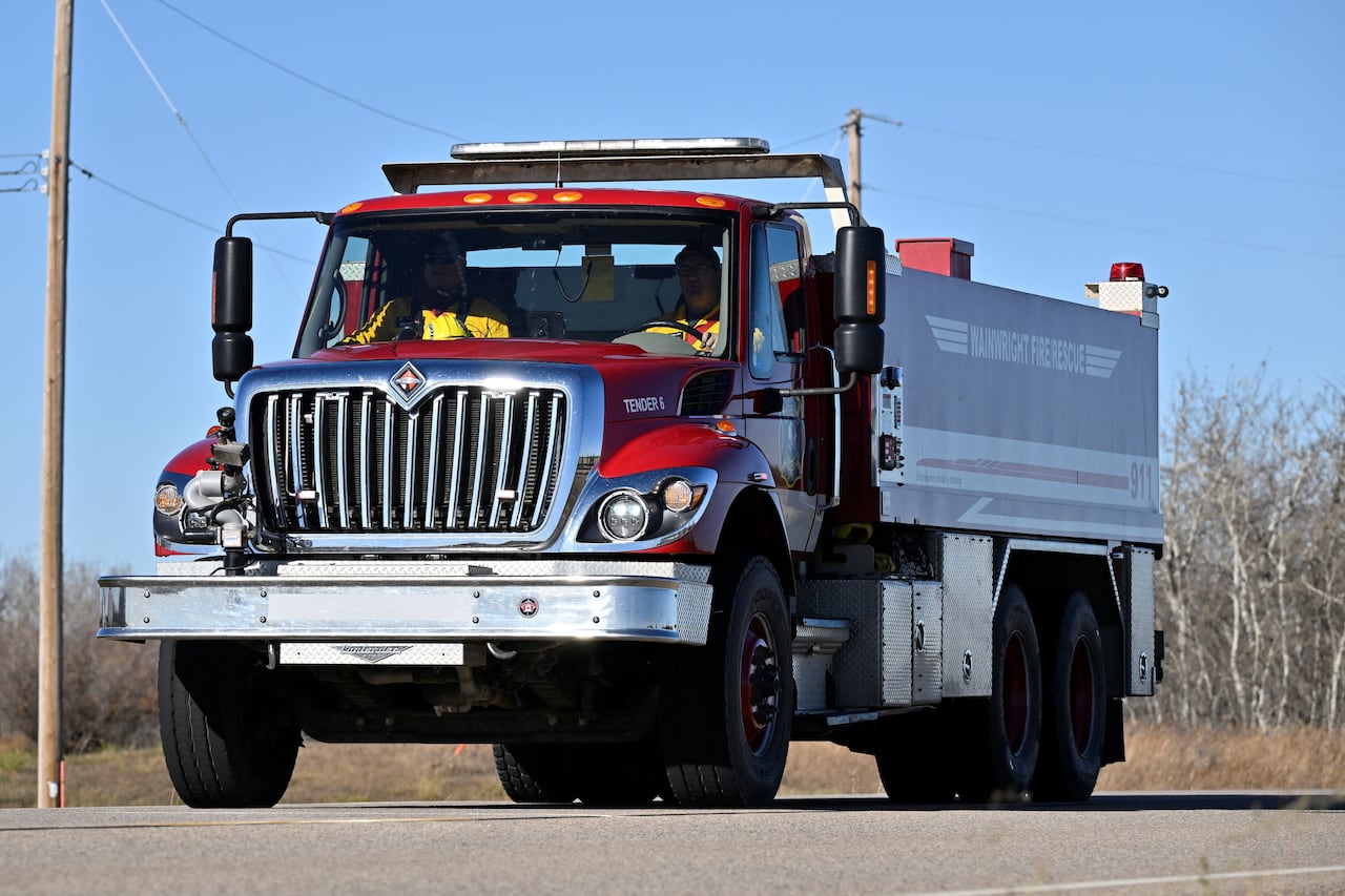 A fire truck is seen on a street.