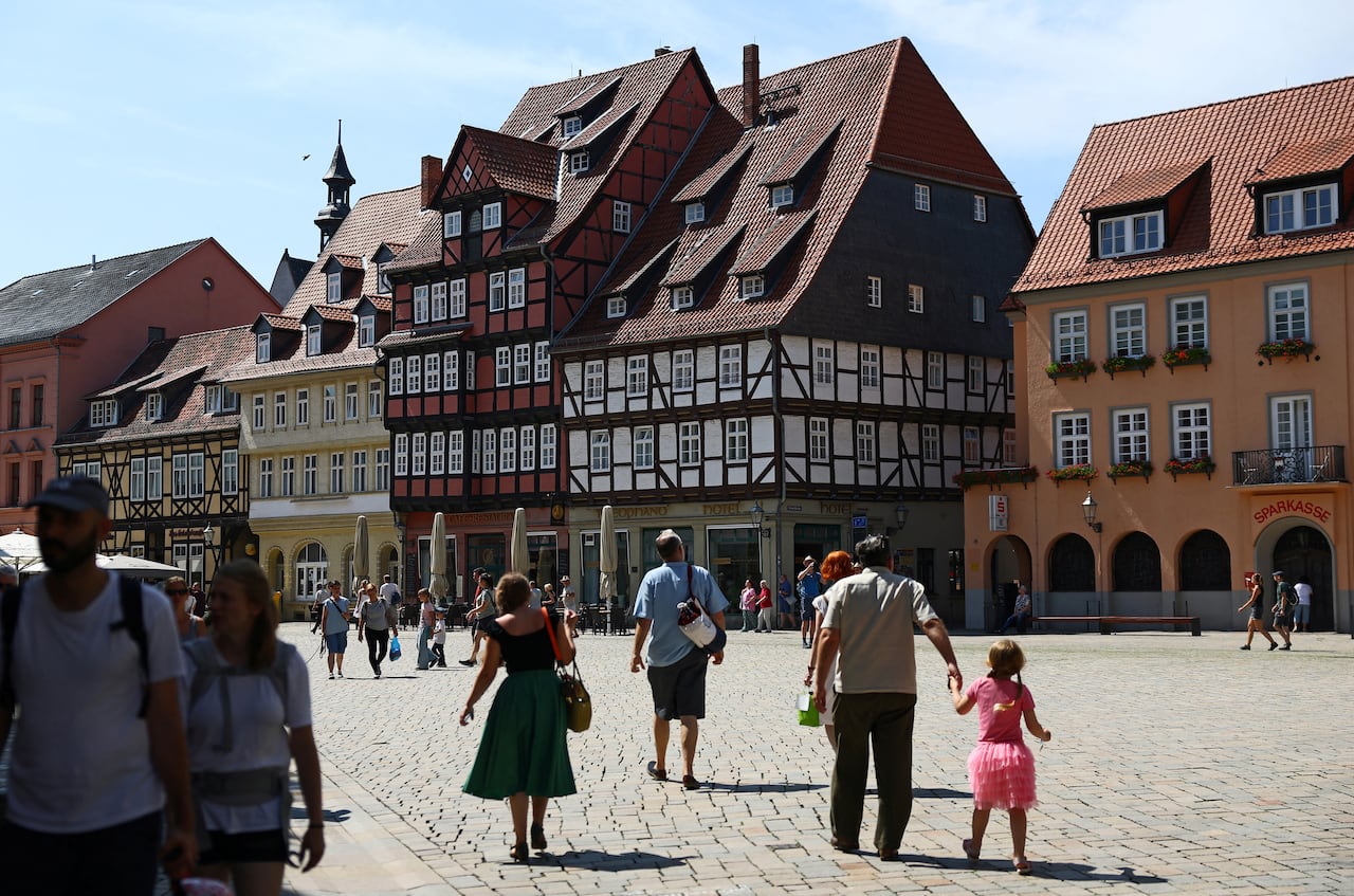 A general view of the historical central plaza with its historic half-timbered construction in Quedlinburg, Saxony-Anhalt, Germany, August 4, 2026. Studies suggest the AfD's rise is fuelled by a lingering sense of economic disadvantage, 36 years afte