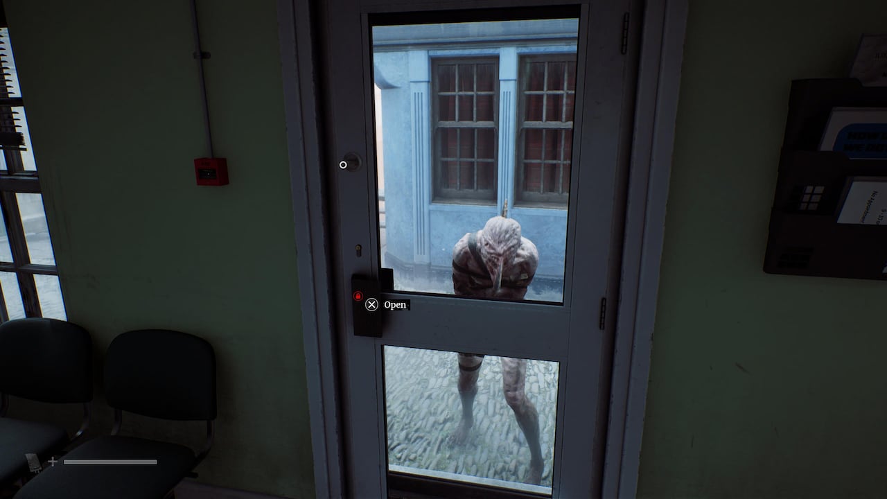 Video game screenshot of a fleshy monster pounding at a door, trying to get inside the building.