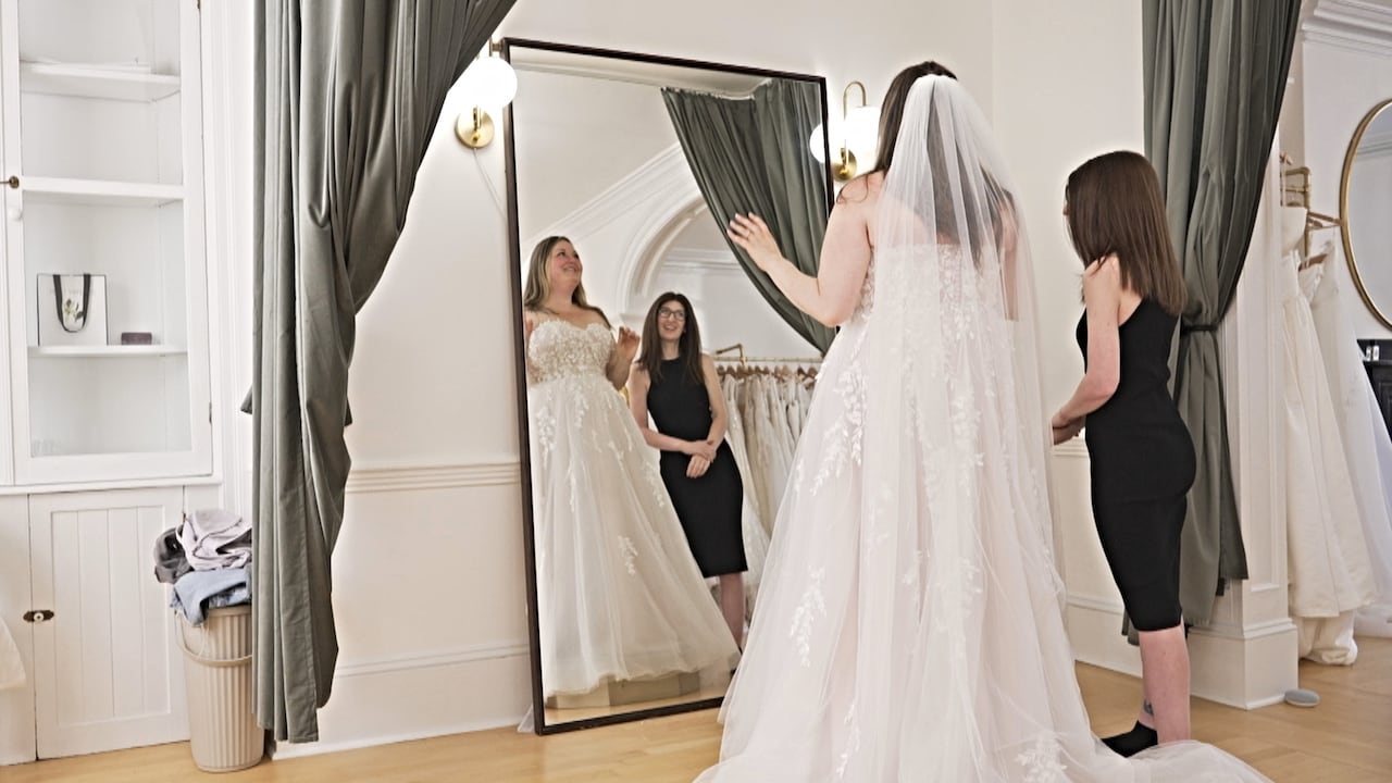 At a private appointment inside Kind Bridal in Halifax, Beverley Smith tries on a wedding dress and discusses alterations to accommodate her ongoing weight loss while using a GLP-1.