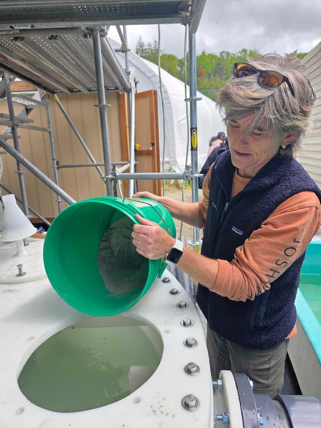 Woman with green container