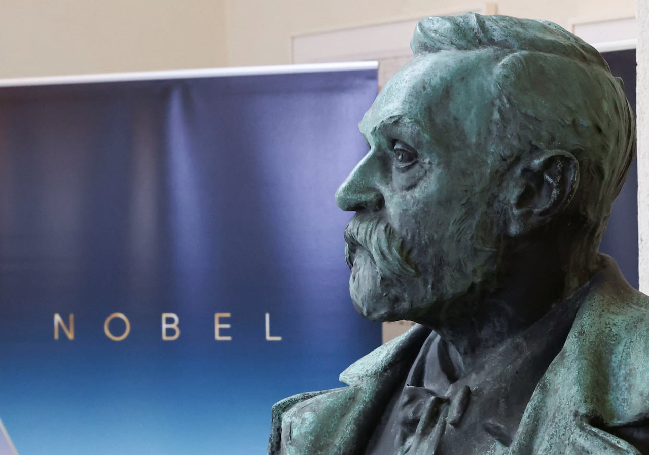 A statue of a man's bearded head is shown in profile.