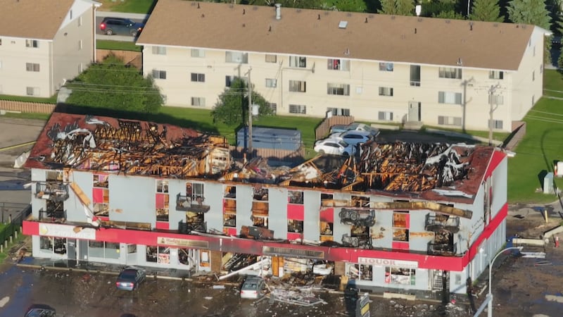 An aerial view of an apartment building at 82 Street and 132 Avenue in Edmonton the morning after a fatal fire on July 13, 2026. (Sean McClune / CTV News Edmonton)