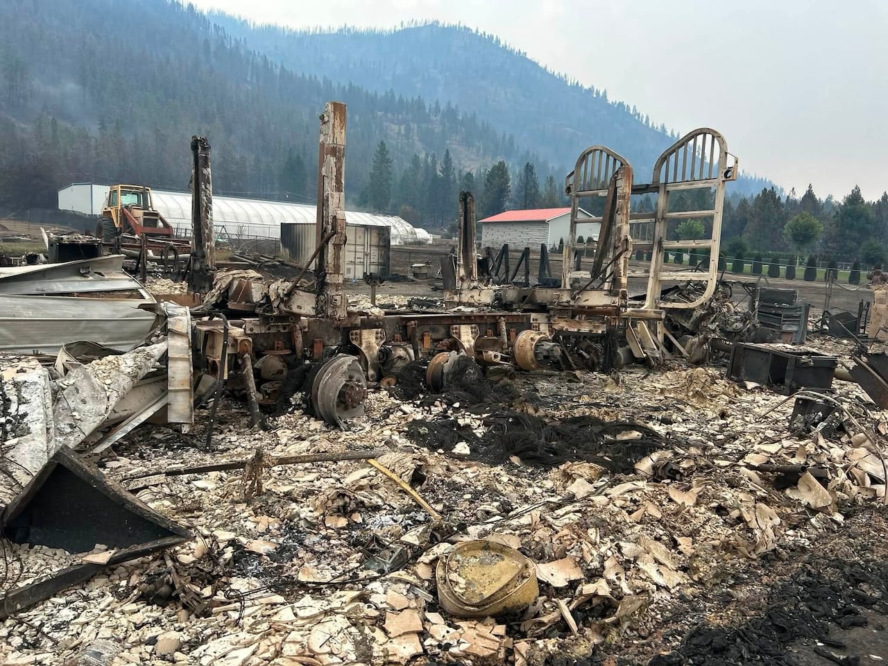 a photo of a burned up logging truck