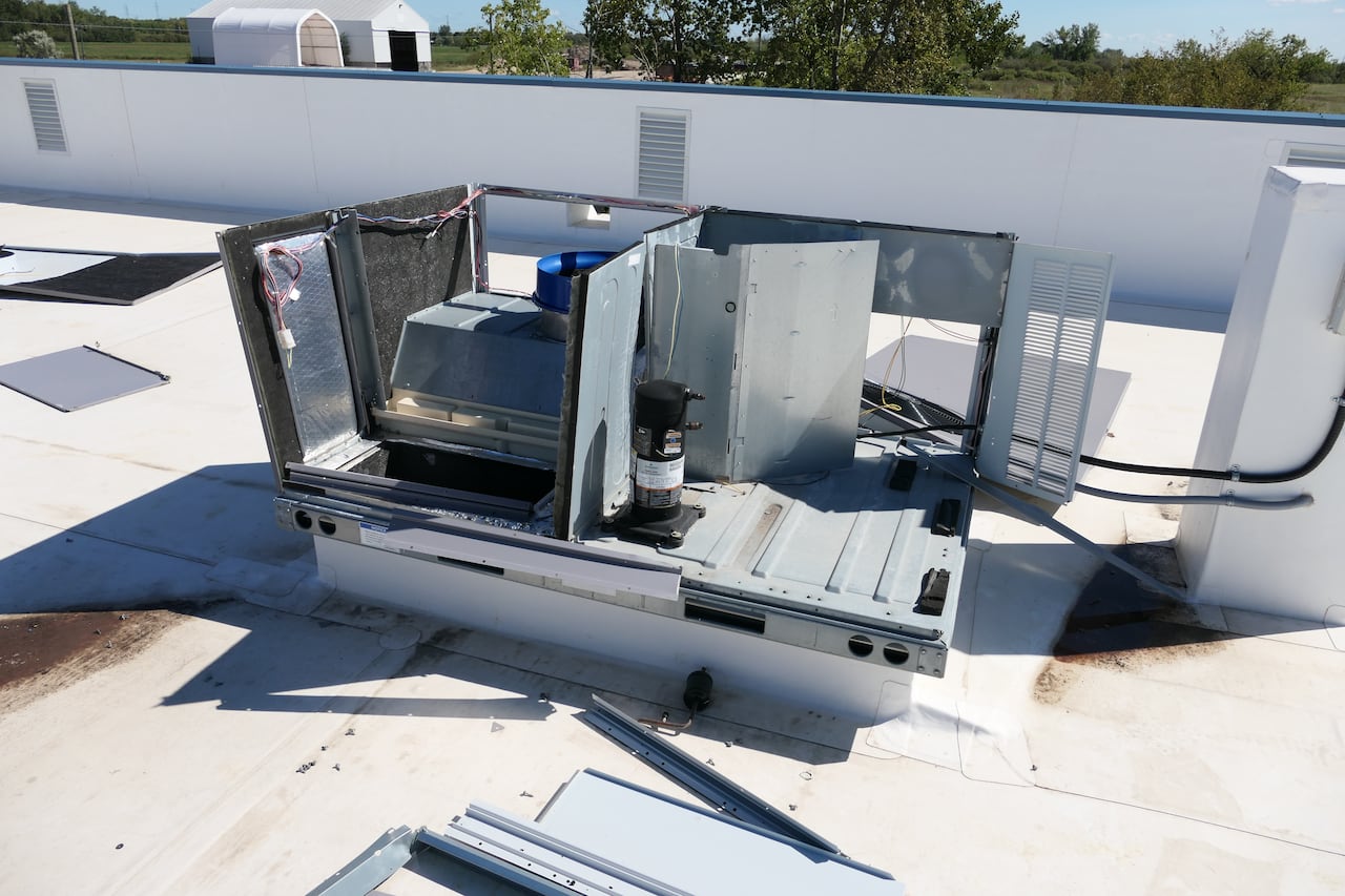 Partly dismantled machinery on a roof.