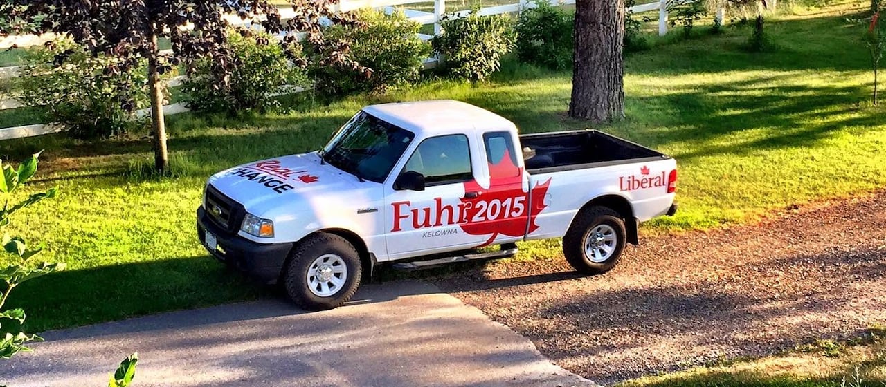 A white truck is decalled with "Fuhr 2015."