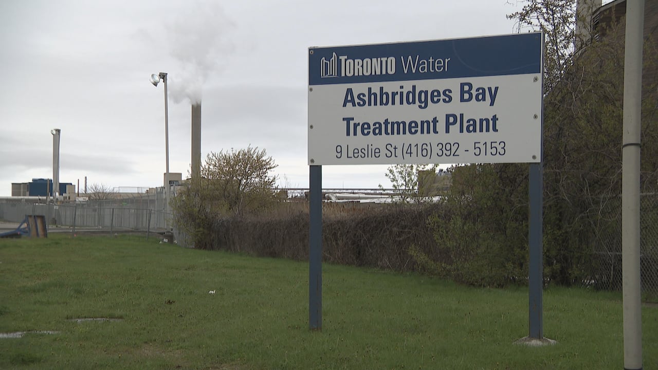 A sign posted outside an industrial building area that reads, "Ashbridges Bay Treatment Plant."
