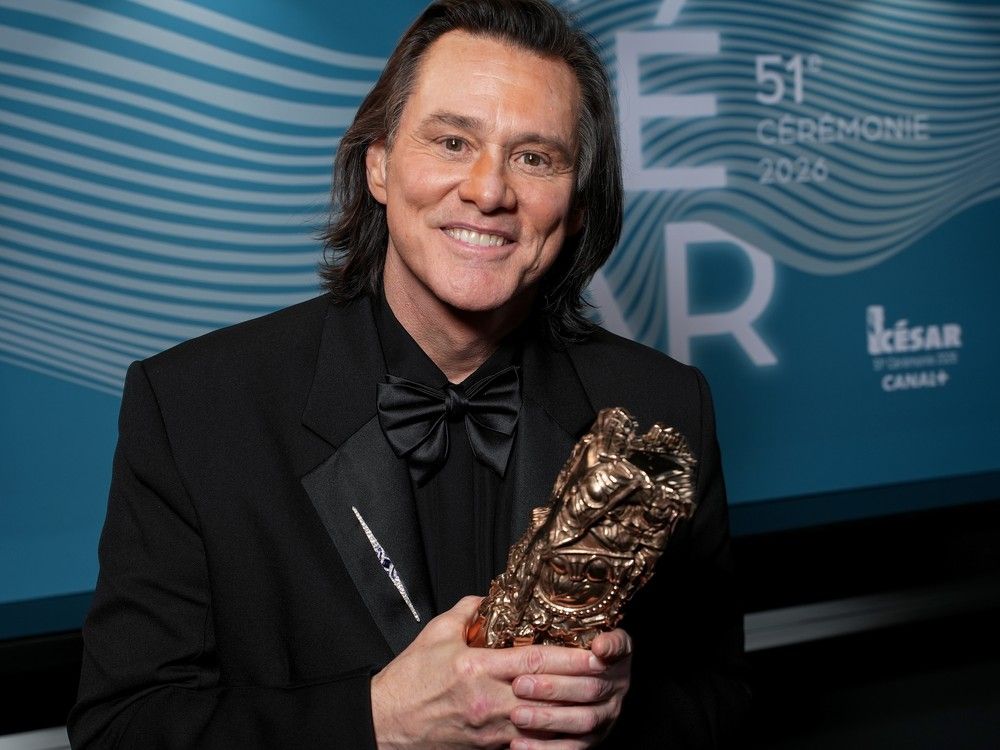 Jim Carrey poses with the Honorary Cesar Award backstage during the 51st Cesar Film Awards at L'Olympia on Feb. 26, 2026 in Paris.