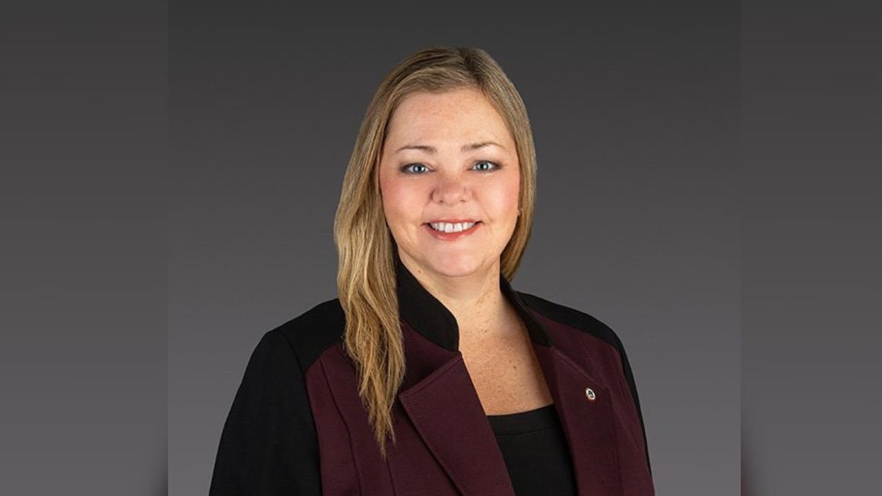 Headshot of a woman in a blazer