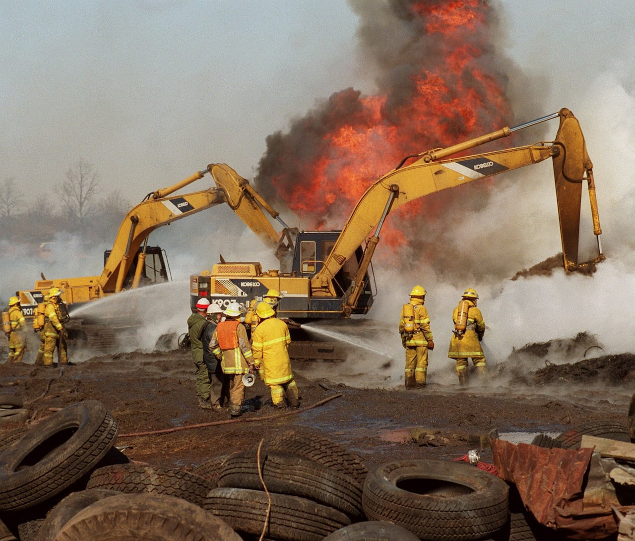 Firefighters battle a tire fire in Hagersville, Ont., Feb. 21, 1990. The fire has spewed toxic smoke and spat thousands of litres of runoff oil for more than a week. (CP PHOTO/ Bill Becker)