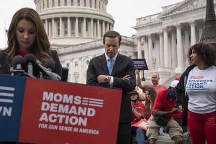 Shannon Watts, founder of Moms Demand Action, left, and Senator Chris Murphy, center, join activists and other Democrats to demand action on gun control in Washington, 26 May 2022.