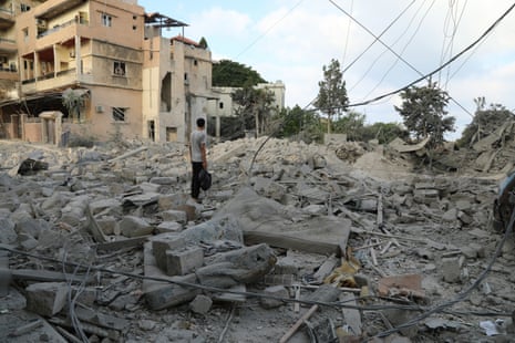 a man standing in debris 