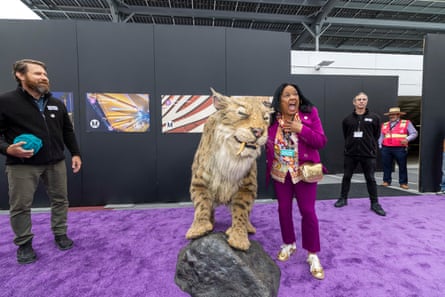 a woman near a tiger statue