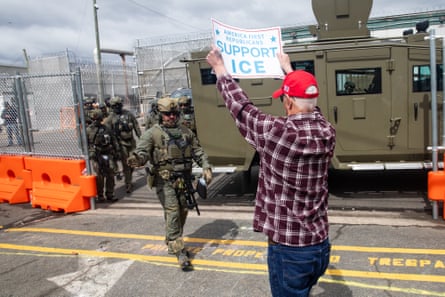 A man holds a sign that reads ‘America first Republicans support ICE’