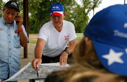 Two men examine a map.