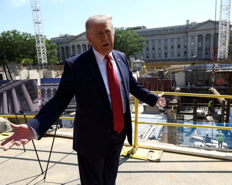 President Donald Trump gestures while speaking at a construction site